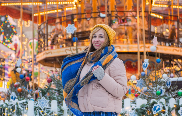 Christmas funfair and fairground guides woman at Christmas funfair